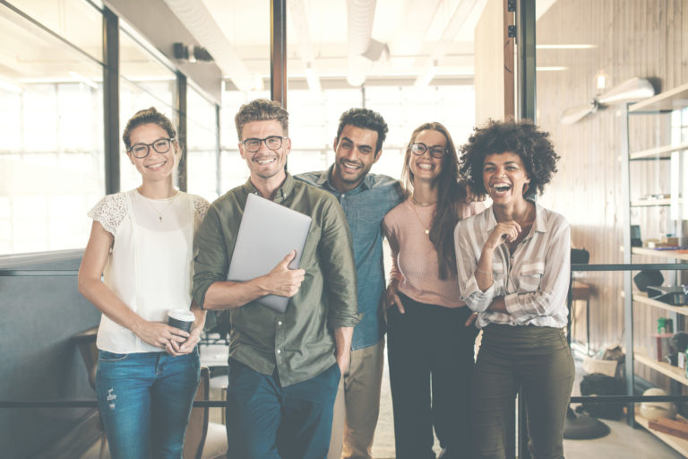 Coworkers enjoy spending time together in the office