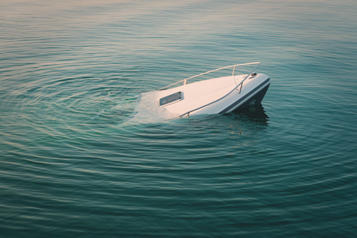 A boat sinks in water