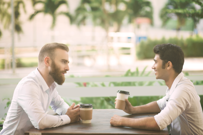 Two colleagues network and build relationships over coffee
