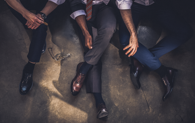 Lonely executives sit on the ground | Lonely at the Top